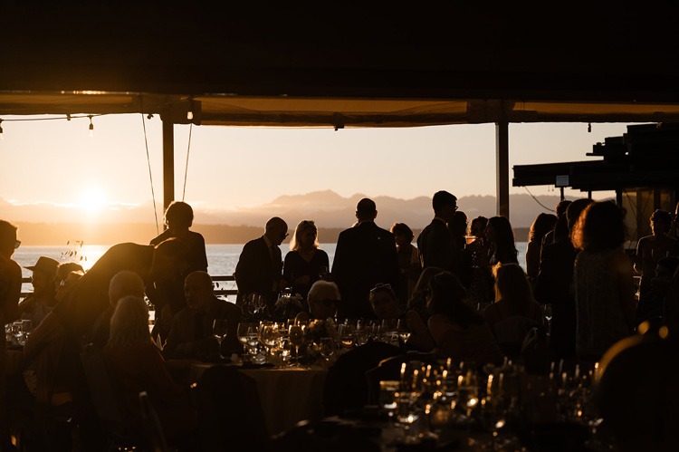 Ray's Private Waterfront Event Venue at Sunset with group of guests